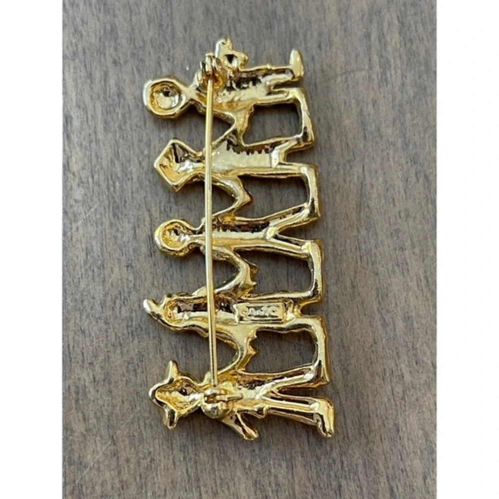 Five Gold-Tone‎ Figures Holding Hands Brooch
